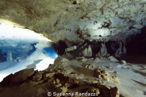 A diver makes his way through a submerged cave near Tulum... by Susanna Randazzo 